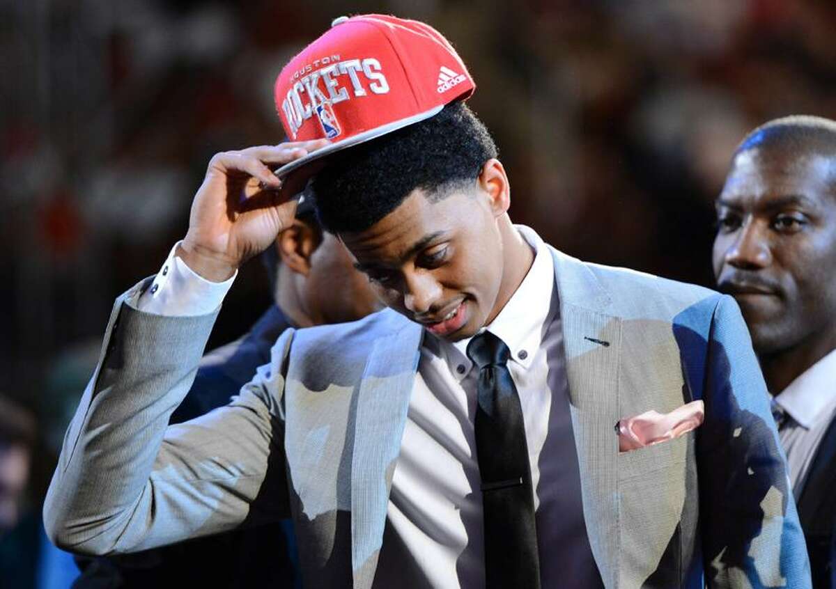 June 28, 2012; Newark, NJ, USA; Jeremy Lamb (Connecticut) puts on a cap after being introduced as the number twelve overall pick to the Houston Rockets during the 2012 NBA Draft at the Prudential Center. Mandatory Credit: Jerry Lai-US PRESSWIRE