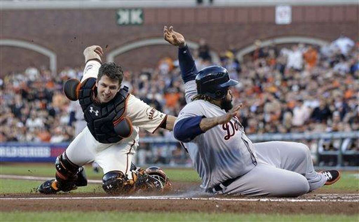Detroit Tigers' Prince Fielder is tagged out at home plate by San Francisco Giants' Buster Posey during the second inning of Game 2 of baseball's World Series Thursday, Oct. 25, 2012, in San Francisco. (AP Photo/Marcio Jose Sanchez)