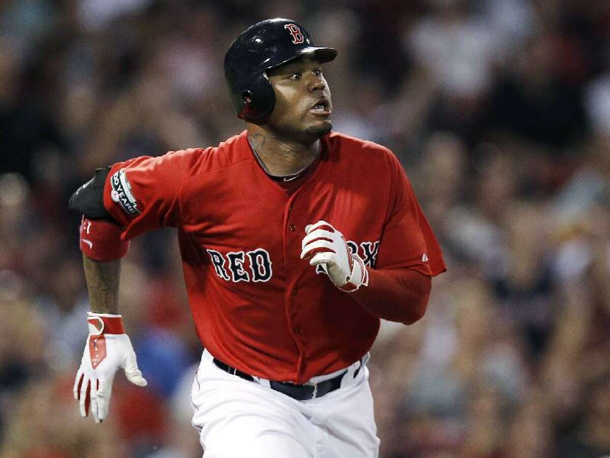 ASSOCIATED PRESS In this Aug. 3 file photo, Boston Red Sox's Carl Crawford watches his three-run home run against the Minnesota Twins during a game in Boston. The Red Sox have traded first baseman Adrian Gonzalez, pitcher Josh Beckett and Crawford to the Los Angeles Dodgers in a nine-player deal.