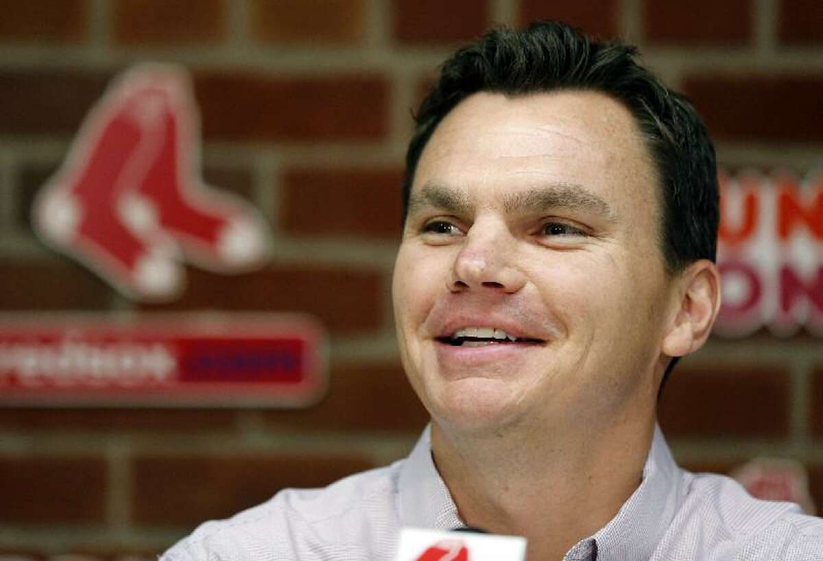 ASSOCIATED PRESS Boston Red Sox general manager Ben Cherington speaks at a news conference at Fenway Park in Boston before Saturday's game between the Red Sox and Kansas City Royals. Cherington announced that the Red Sox sent first baseman Adrian Gonzalez, pitcher Josh Beckett and outfielder Carl Crawford to the Dodgers on Saturday, parting with the high-priced stars in a nine-player trade that is the biggest swap in Los Angeles' history.