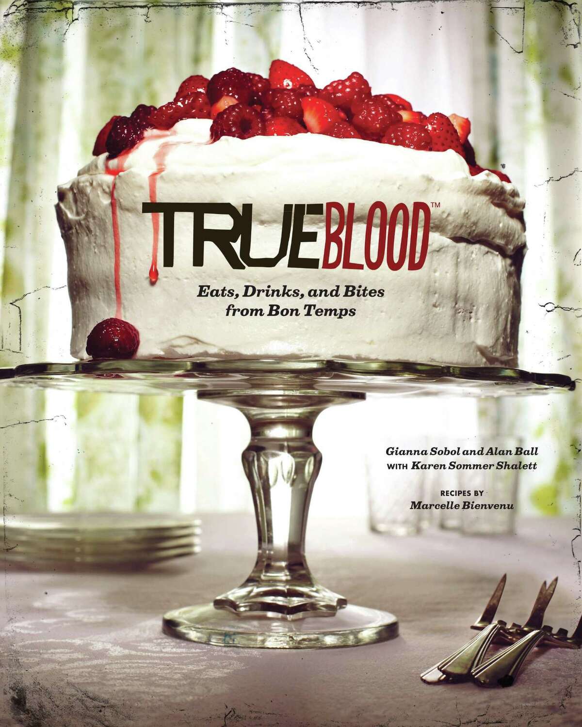 This book cover image released by Chronicle Books shows "True Blood: East, Drinks, and Bites from Bon Temps," a cookbook with recipes by Marcelle Bienvenu. (AP Photo/Chronicle Books)