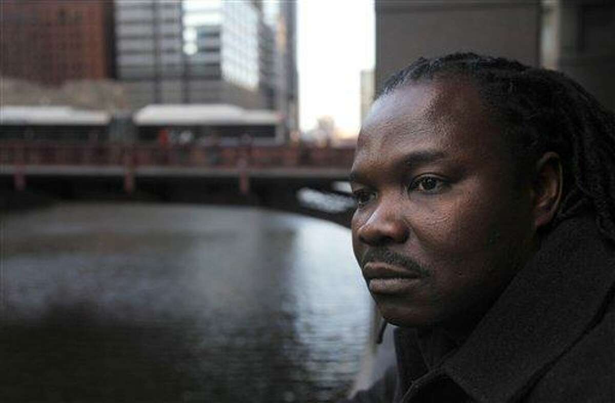 Nigerian-born Charles Wiwa, 44, poses for a portrait in Chicago. Wiwa, fled Nigeria in 1996 following a crackdown on protests against Shell's oil operations in the Niger Delta. He and other natives of the oil-rich Ogoni region claim Shell was eager to stop protests in the area and was complicit in Nigerian government actions that included fatal shootings, rapes, beatings, arrests and property destruction. He said an American court is the only place the Ogonis can seek accountability. Associated Press