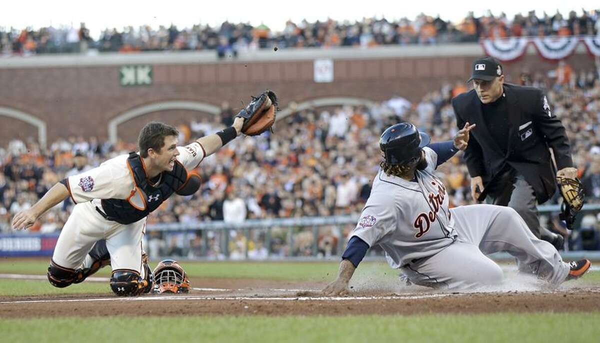 Detroit Tigers' Prince Fielder is tagged out at home plate by San Francisco Giants' Buster Posey, left, during the second inning of Game 2 of baseball's World Series Thursday, Oct. 25, 2012, in San Francisco. Umpire Dan Iassogna makes the call at the plate. (AP Photo/Marcio Jose Sanchez)