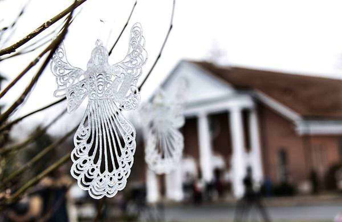 Twenty Seven of these angels dangle on a tree outside Saint Rose Lima Church in Newtown Connecticut. Photo by Mia M. Malafronte