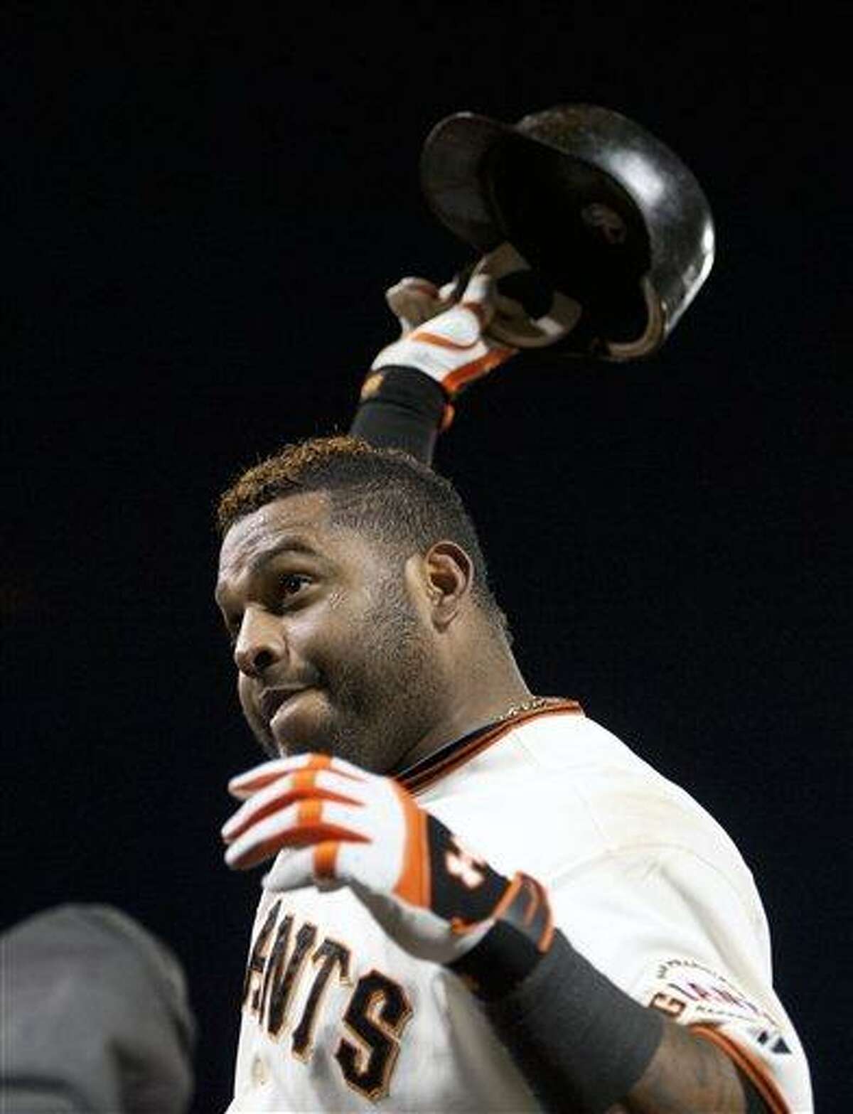 San Francisco Giants' Pablo Sandoval tips his helmet to the crowd after hitting his third home run against the Detroit Tigers during Game 1 of baseball's World Series, Wednesday, Oct. 24, 2012, in San Francisco. (AP Photo/The Sacramento Bee, Paul Kitagaki Jr.) MAGS OUT; TV OUT (KCRA3, KXTV10, KOVR13, KUVS19, KMAZ31, KTXL40) MANDATORY CREDIT