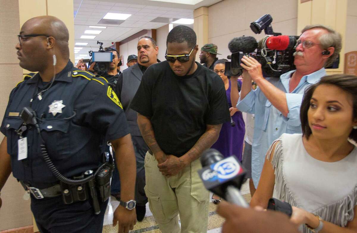 Houston rapper Joseph Wayne McVey, commonly known by "Z-Ro," leaves the 351st courtroom of the Harris County Courthouse Thursday, July 27 2017, in Houston. McVey is accused of beating his now ex-girlfriend Brittany Bullock, also known by her rapper stage name "Just Brittany," while brandishing a handgun in his Katy area home in April.