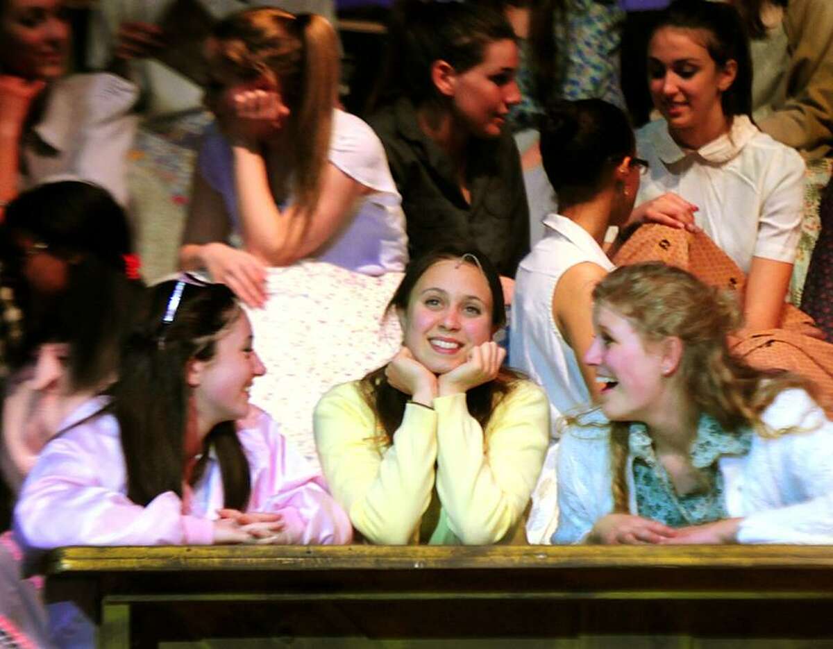 Hillary Dadio-Perrone, center, playing Sandy Dombrowsk, in a scene from the Hamden High School production of Grease. Melanie Stengel/Register
