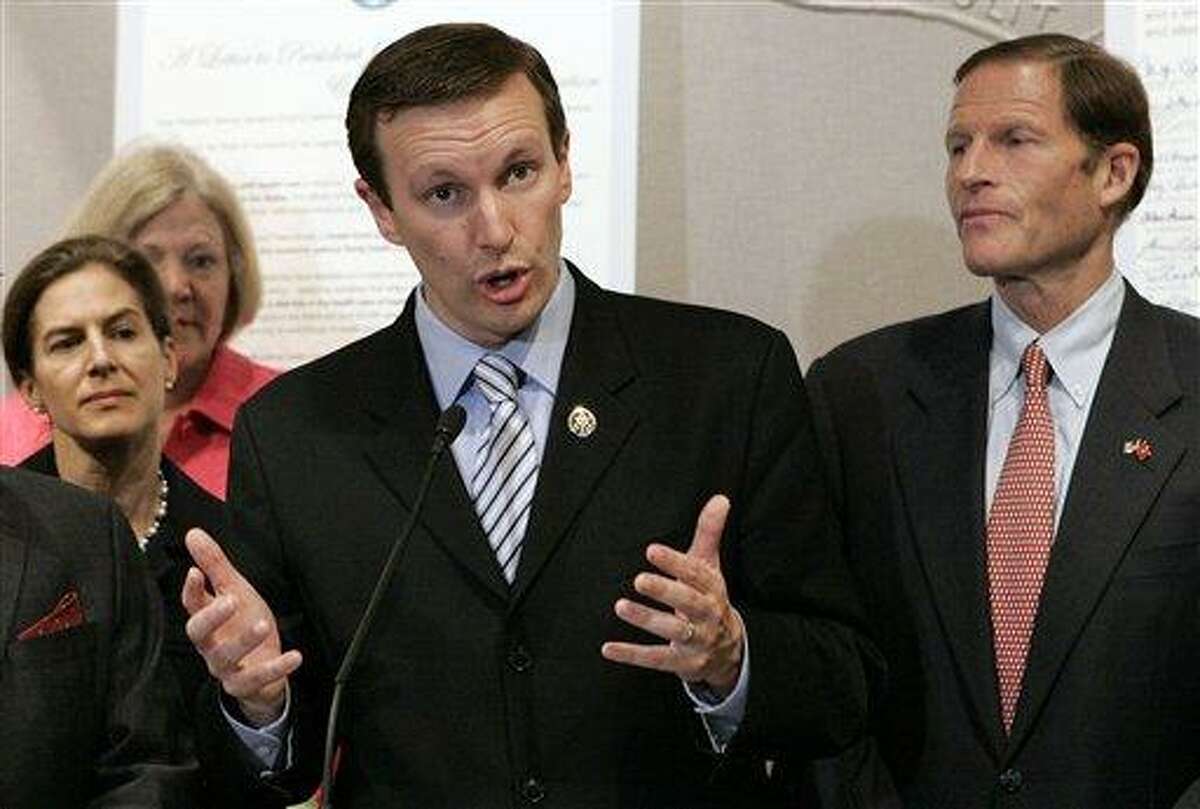 FILE - In this June 15, 2099 file photo, U.S. Rep. Christopher Murphy, D-Conn., speaks at a news conference in Hartford, Conn. Listening to Murphy are from left: Secretary of State Susan Bysiewicz; Murphy; and then-state Attorney General, now U.S. Sen. Richard Blumenthal, D-Conn. Murphy, Bysiewicz and state Rep. William Tong are vying for their party's endorsement for the November 2012 general election to fill the U.S. Senate seat being vacated by Joseph Lieberman, an independent who is retiring. (AP Photo/Bob Child, File)