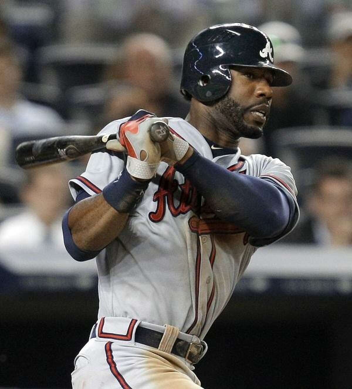 Atlanta Braves' Jason Heyward watches his infield single during the sixth inning of the Braves' baseball game against the New York Yankees at Yankee Stadium in New York , Tuesday, June 19, 2012. The ball hit New York Yankees first baseman Mark Teixeira on the foot. (AP Photo/Kathy Willens)