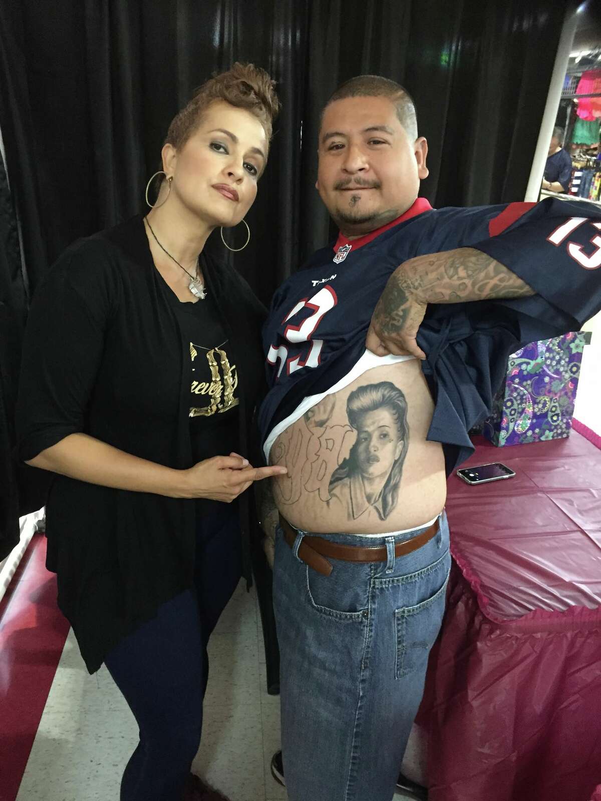 Angel Aviles with a fan who has a tattoo of her character, Sad Girl, from the film "Mi Vida Loca."