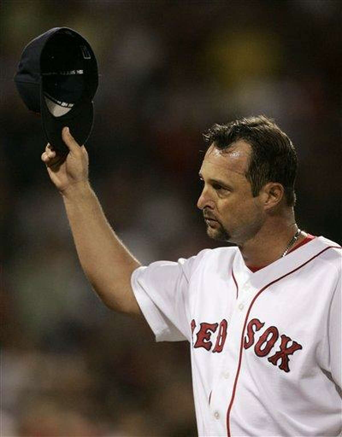 ** FILE ** Boston Red Sox starter Tim Wakefield tips his cap to the crowd while leaving in the seventh inning leading 2-1 against the Texas Rangers during their baseball game at Fenway Park in Boston, in this June 29, 2007 file photo. (AP Photo/Charles Krupa)