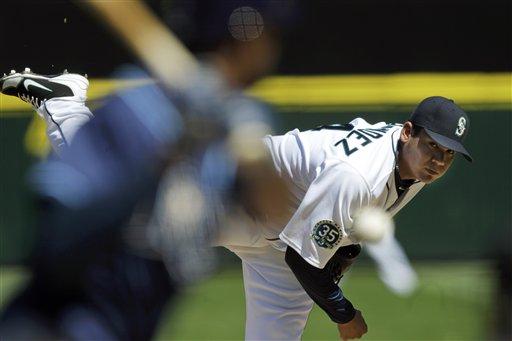 Seattle Mariners pitcher Felix Hernandez is greeted by teammates after he  threw a perfect baseball game against the Tampa Bay Rays, Wednesday, Aug.  15, 2012, in Seattle. (AP Photo/Ted S. Warren Stock