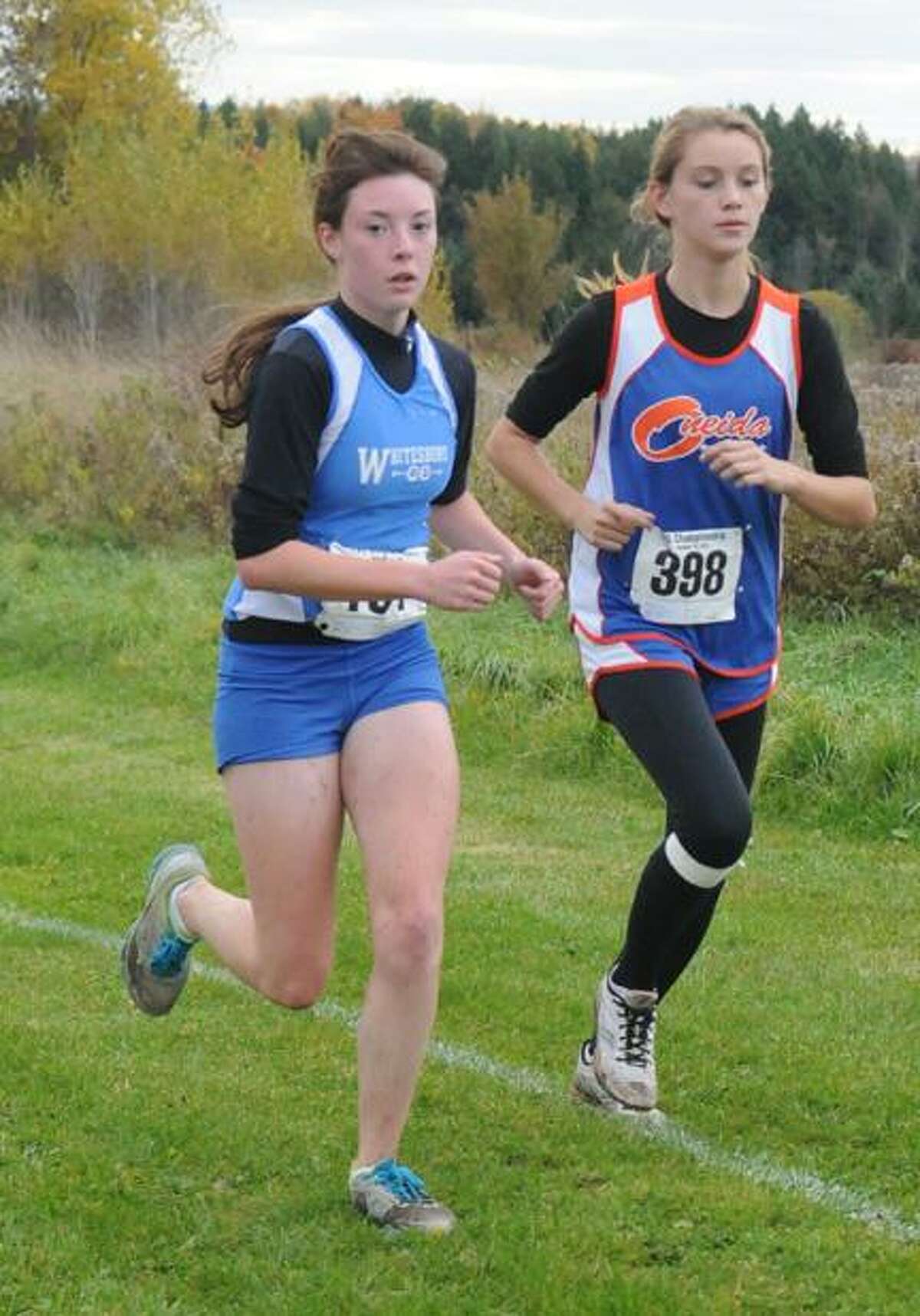 Submitted Photo by Ryan Orilio Oneida's Jordan Newton, right, and Whitesboro's Mary Manzari compete in the Tri-Valley League championship meet Tuesday at SUNY IT. Newton placed 11th at the meet with a time of 21:55.