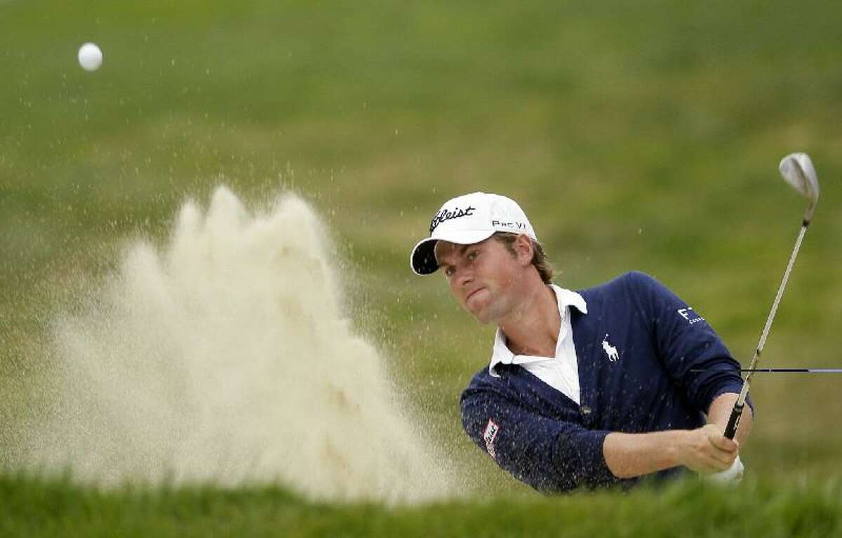 ASSOCIATED PRESS Webb Simpson hits out of a bunker on the 17th hole during the fourth round of the U.S. Open Championship golf tournament Sunday at The Olympic Club in San Francisco.