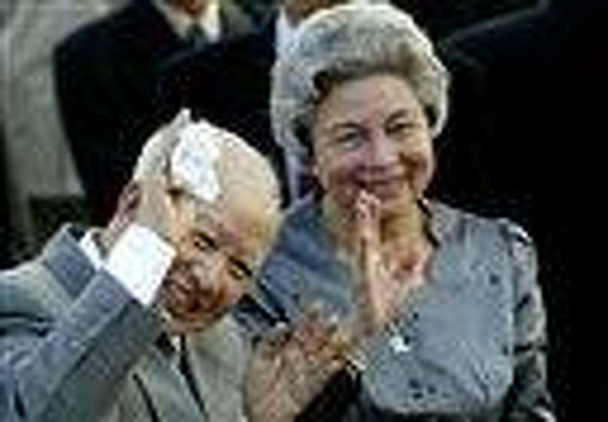 Former King Norodom Sihanouk and Queen Monineath wave at Phnom Penh airport, in Cambodia. Sihanouk, who was never far from the center of his country's politics through a half-century of war, genocide and upheaval, died of natural causes early Monday. AP Photo