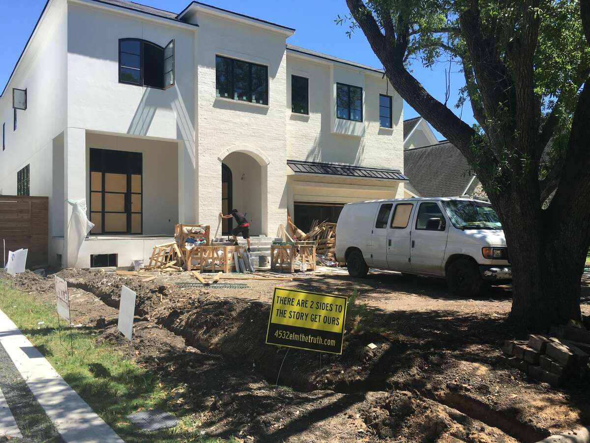 Custom homebuilder Roy Gabbay has been charged with tampering with a government document in relation to a luxury home under construction in Bellaire. Upset homeowners in the neighborhood have responded with yard signs, pictured Thursday, Aug. 27, 2017.
