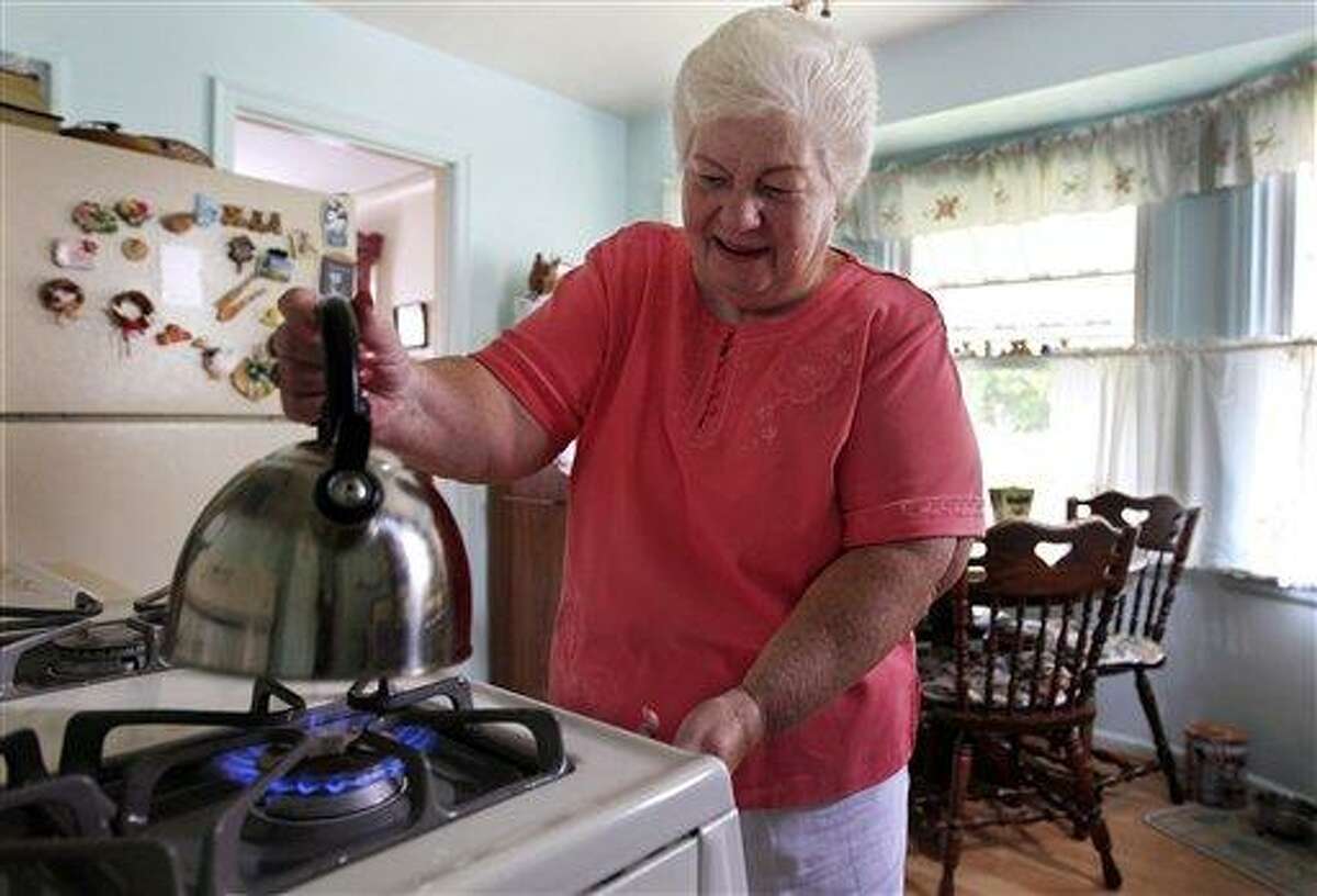 Marge Youngs is shown in her home in Toledo, Ohio. As millions of baby boomers flood Social Security with applications for benefits, the program's $2.7 trillion surplus is starting to look small. Since 2010, Social Security has been paying out more in benefits than it collects in taxes, adding to the urgency for Congress to address the program's long-term finances. (Associated Press photo)