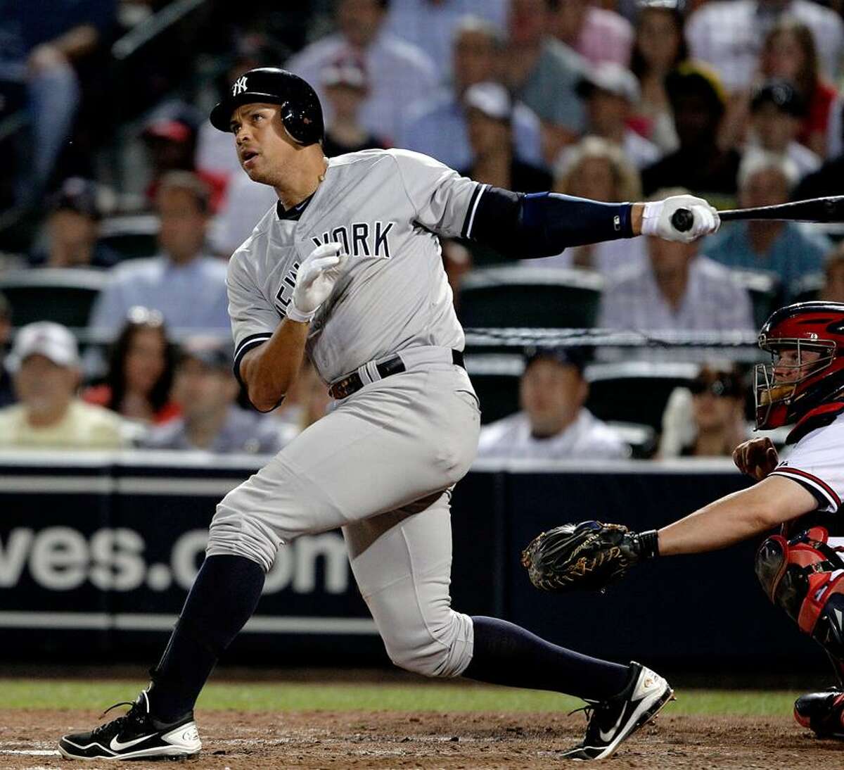 New York Yankees' Alex Rodriguez watches his grand slame in the eighth inning of a baseball game against the Atlanta Braves on Tuesday, June 12, 2012, in Atlanta. (AP Photo/David Goldman)
