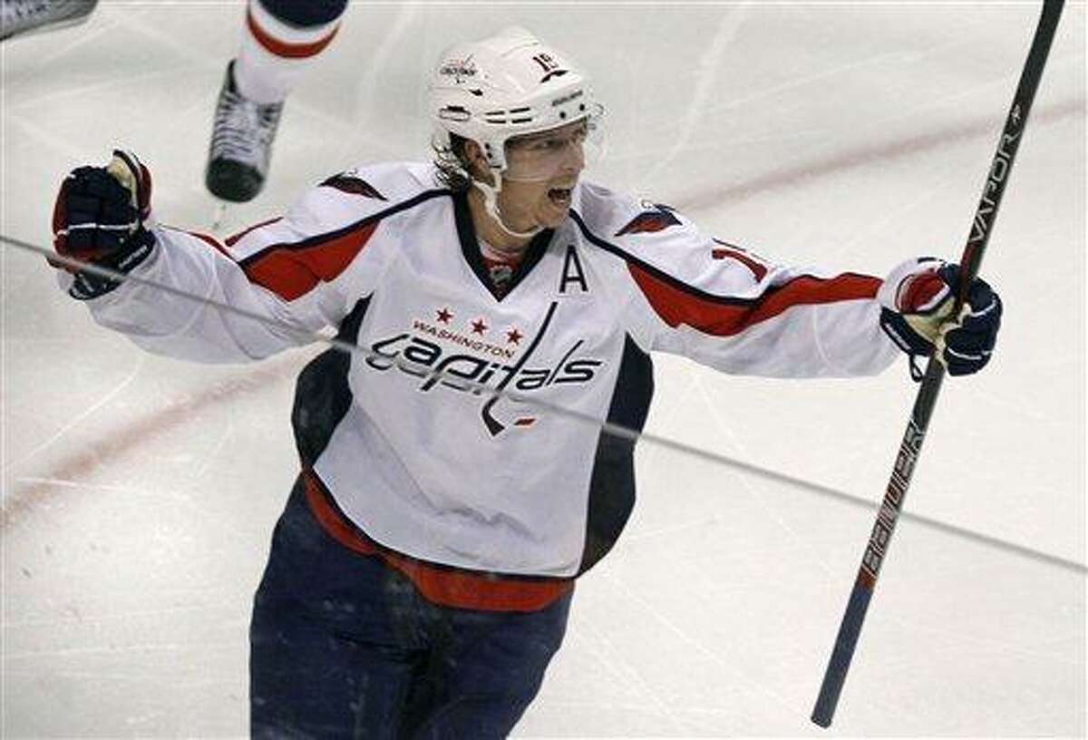 Washington Capitals center Nicklas Backstrom (19) celebrates his game-winning goal against the Boston Bruins during the second overtime period of Game 2 of an NHL hockey Stanley Cup first-round playoff series in Boston, Saturday, April 14, 2012. The Capitals won 2-1, tying the series at 1-1. (AP Photo/Charles Krupa)