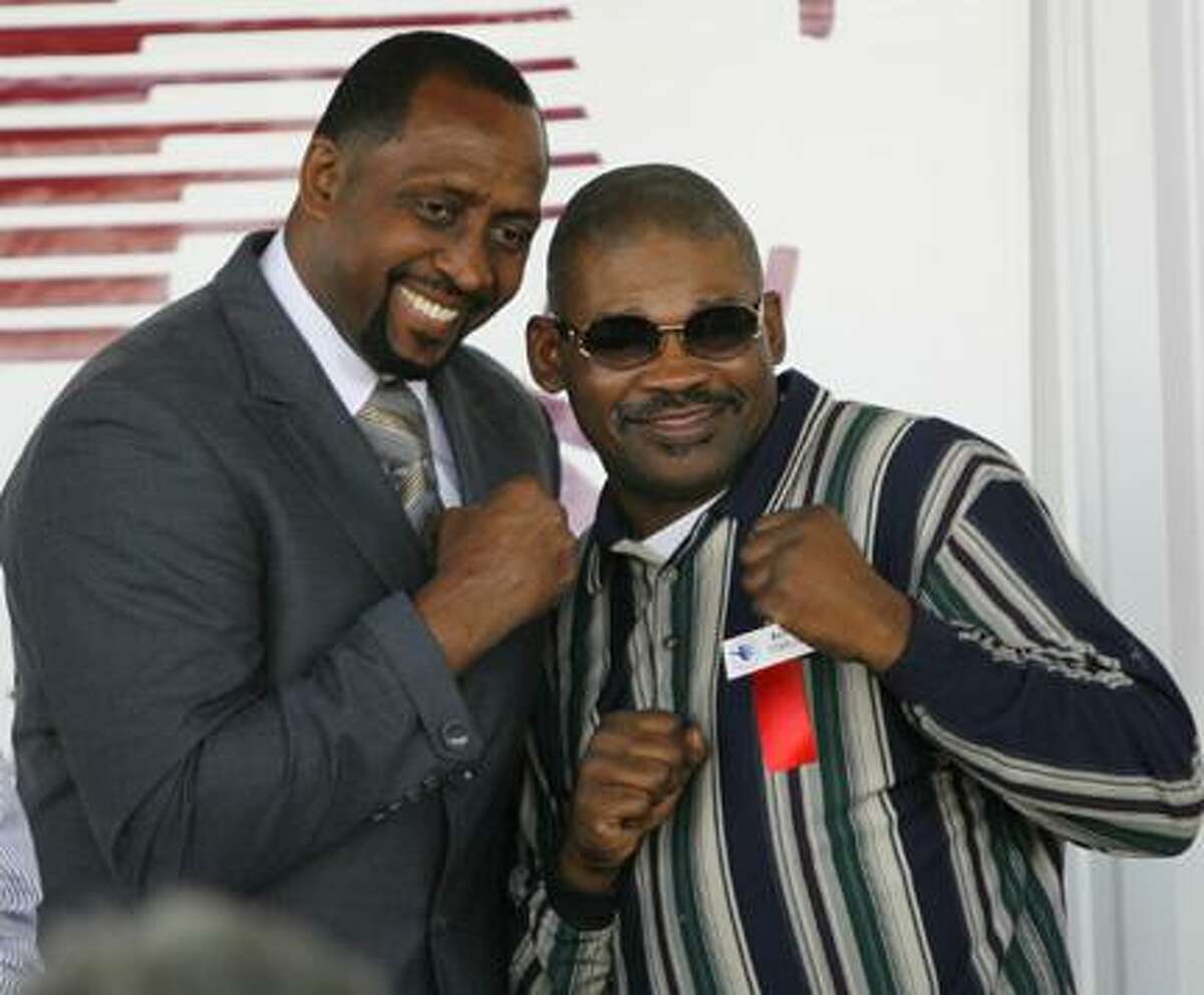 Dispatch Staff Photo by JOHN HAEGER (Twitter.com/OneidaPhoto)2012 International Boxing Hall of Fame inductee Thomas Hearns poses for fans with Marlon Starling at the opening ceremony at the hall on Thursday, June 7, 2012 in Canastota.