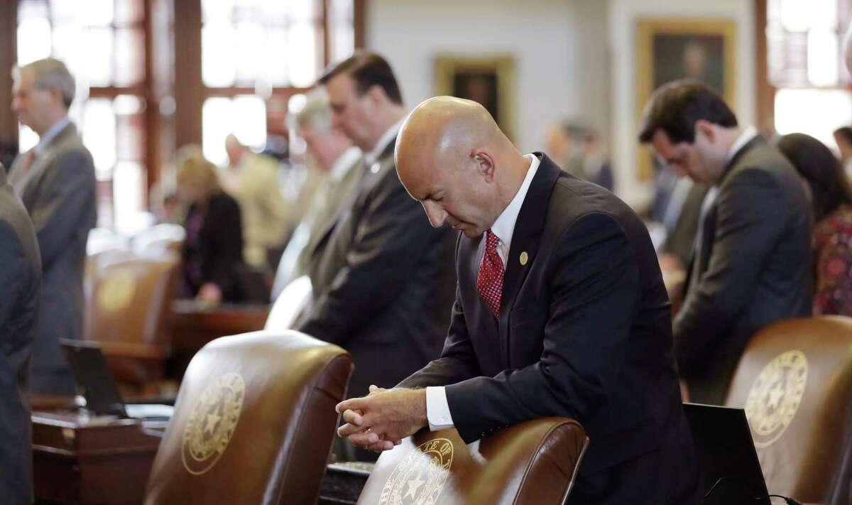 Texas Rep. Matt Shaheen, R-Plano, center, prayers with fellow lawmakers in Austin on July 18, when State lawmakers begin a special legislative session called by Republican Gov. Greg Abbott to tackle conservative priorities that stalled previously, chief among them a "bathroom bill" targeting transgender people. (AP Photo/Eric Gay)