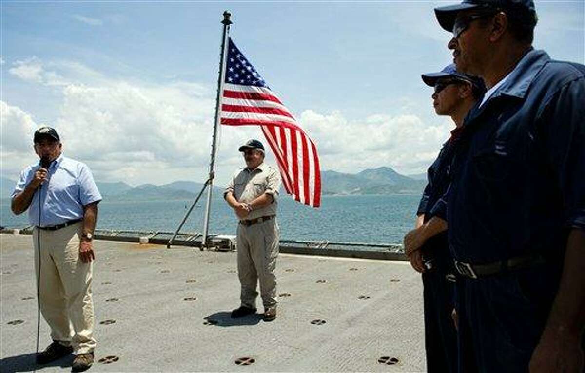 U.S. Secretary of Defense Leon Panetta, left, speaks Sunday to crew members as he visits the USNS Richard E. Byrd in Cam Ranh Bay, Vietnam. Panetta toured the former U.S. air and naval base in the bay, becoming the most senior American official to go there since the war ended. Associated Press