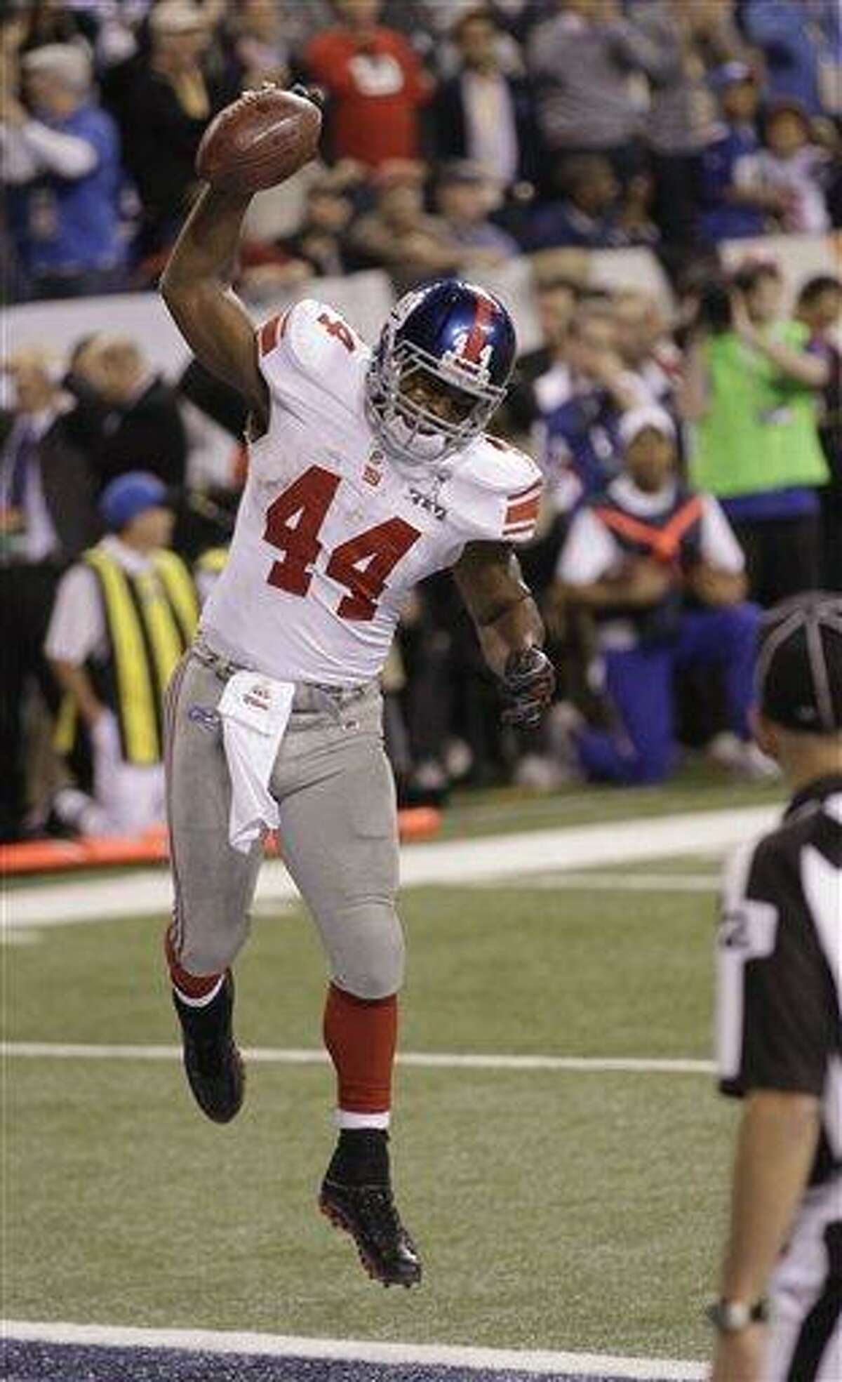 New York Giants quarterback Eli Manning goes for two points after leading  the Giants on game winning drive against the New England Patriots late in  the fourth quarter at Super Bowl XLVI