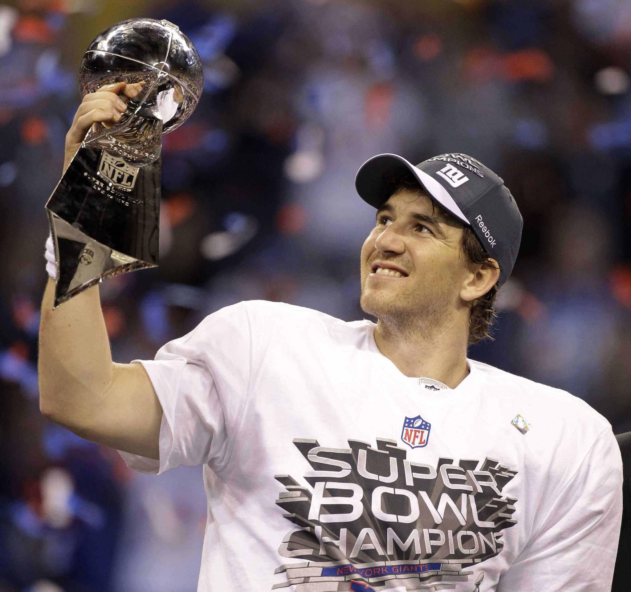 New England Patriots quarterback Tom Brady is hit by New York Giants  defensive end Justin Tuck as he throws a pass down field during Super Bowl  XLVI February 5, 2012, in Indianapolis.