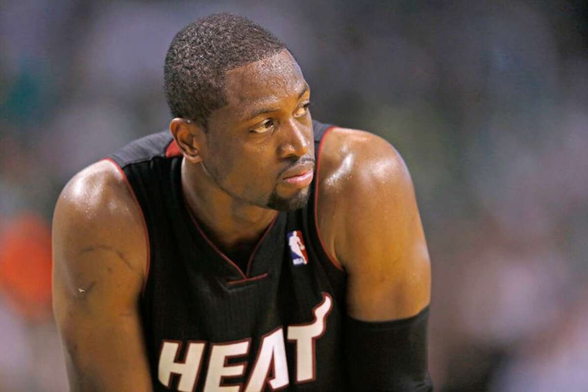 Heat snap five-game losing streak in Wade's return