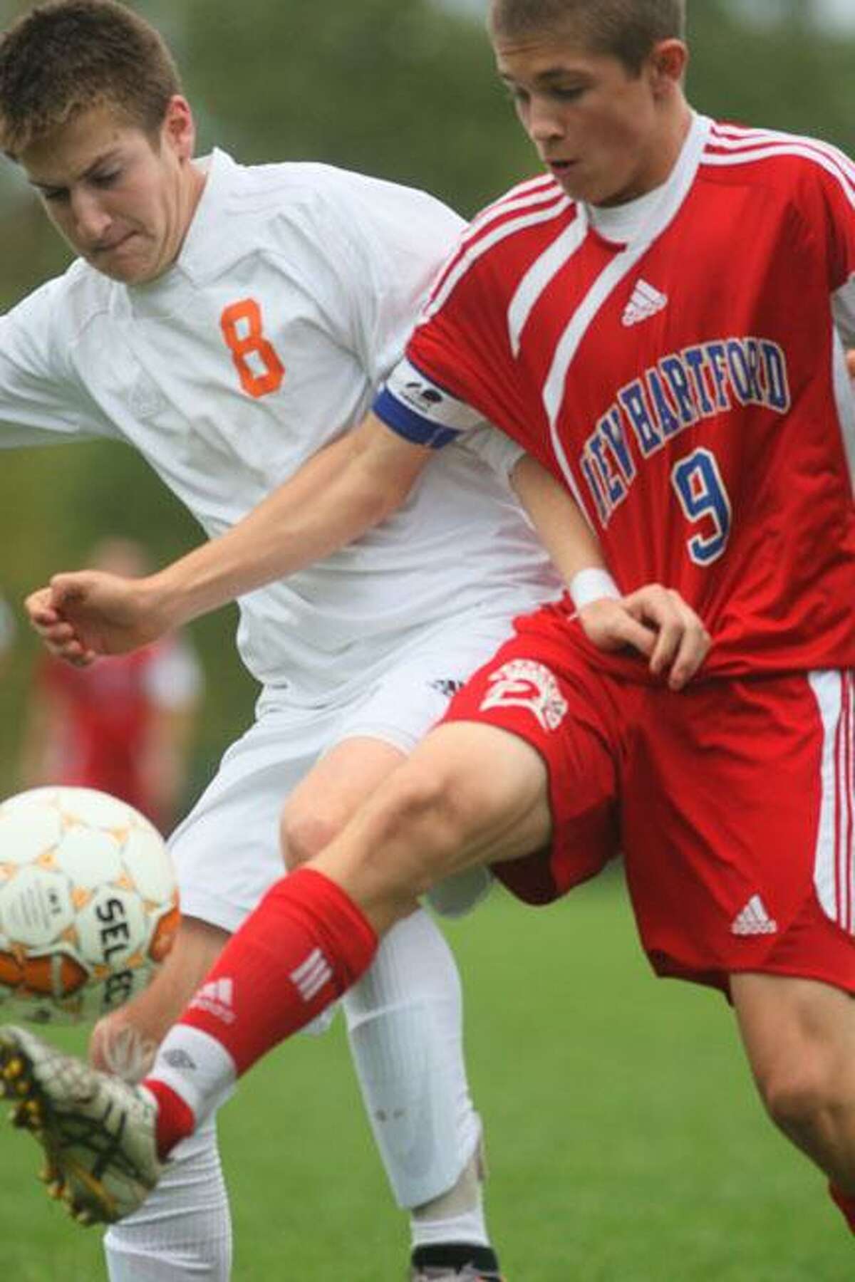 Dispatch Staff Photo by JOHN HAEGER (Twitter.com/OneidaPhoto)New Hartford's Troy King (9) controls the ball as Oneida's Zach Wartella (8) defends in the first half of their match in Oneida on Tuesday, Oct. 2, 2012.