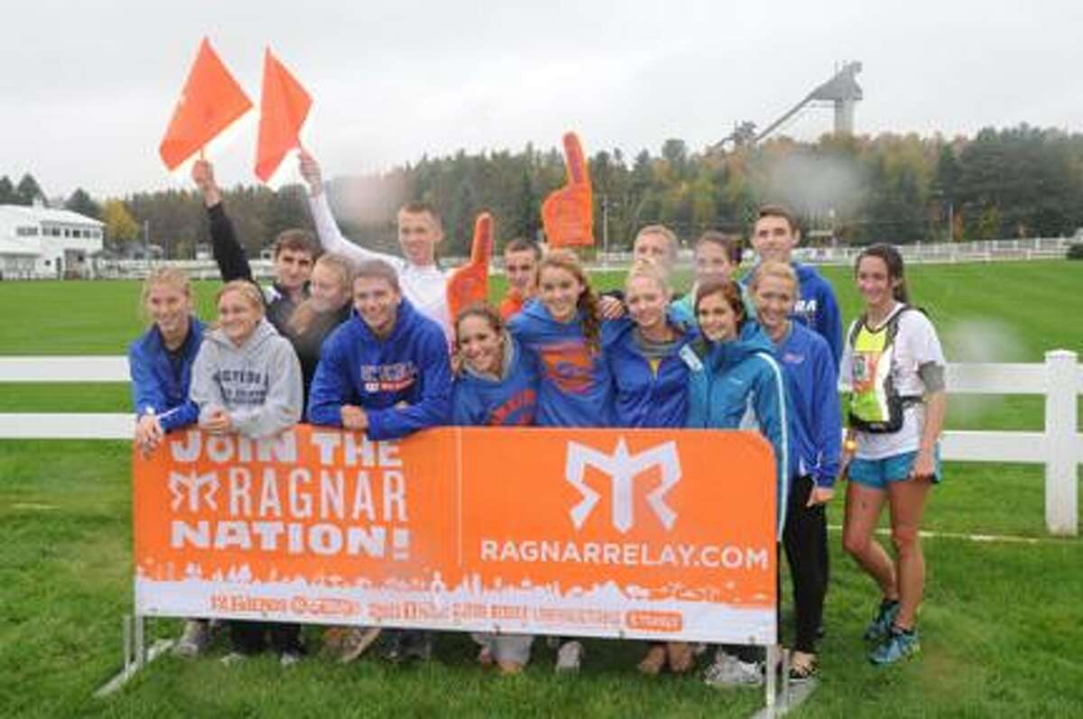 Submitted Photo by RYAN ORILIO Kim DeCarr, Makayla Foster, Jen Scholl, Rachel Coons, Logan Hamilton, Melanie Rose, Cassidy McJury, Sam Decarciofolo, Brooke Scribner, Jordan Newton, Elijah Sullivan, Dakota Corney, Will Coulter, Sean Ploth, Sevack Danadian and Eric Williamson stand with the Ragnar Relay banner after finishing a 192-mile relay through the Adirondacks. The team took first in the high school division.