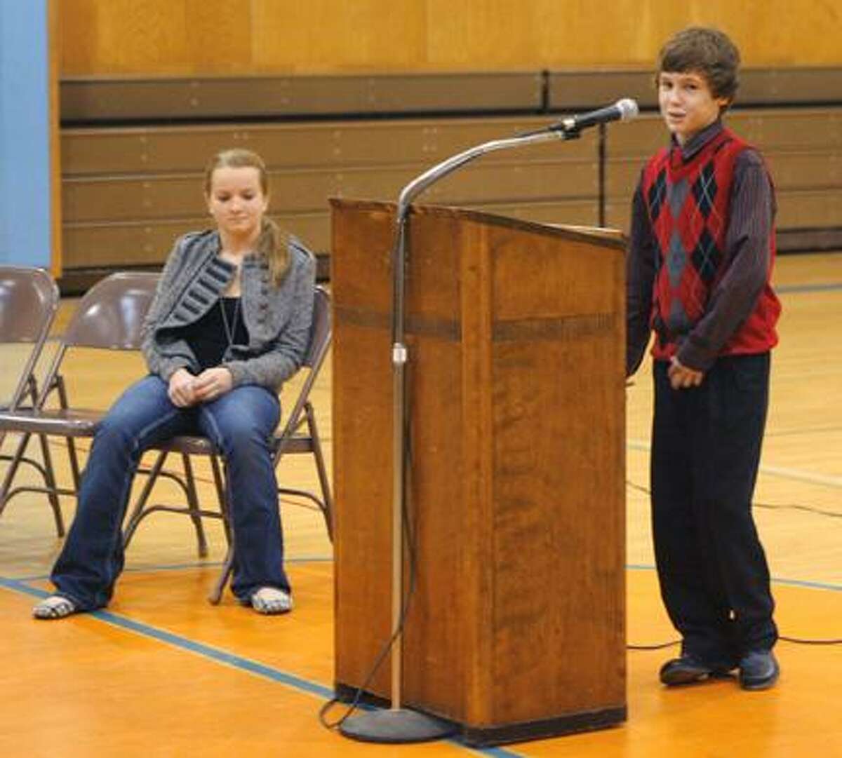 Photo by JOHN HAEGER (Twitter.com/OneidaPhoto) Otto Shortell Middle School seventh grader Tanner Williams reacts after winning the annual Oneida City School District 2011 Spelling Bee on Tuesday, Nov. 29, 2011 held at the school in Wampsville. Looking on in the background is second place finisher Jadah Gann.