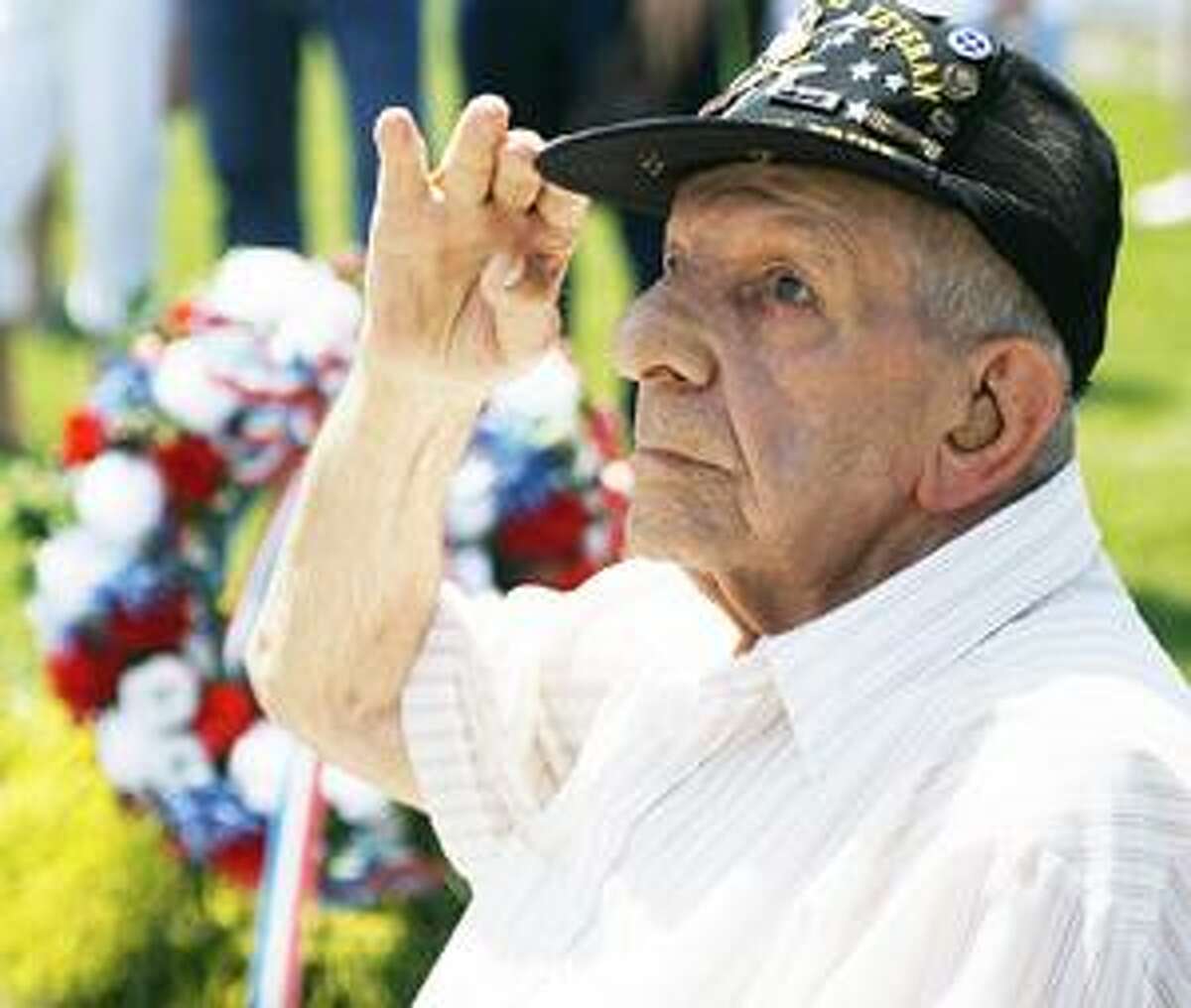 Dispatch Staff Photo by JOHN HAEGER World War II veteran Sylvester Ciotti salutes during the playing of Taps during the annual Memorial Day service in the Town of Vernon on Monday, May 30, 2011.