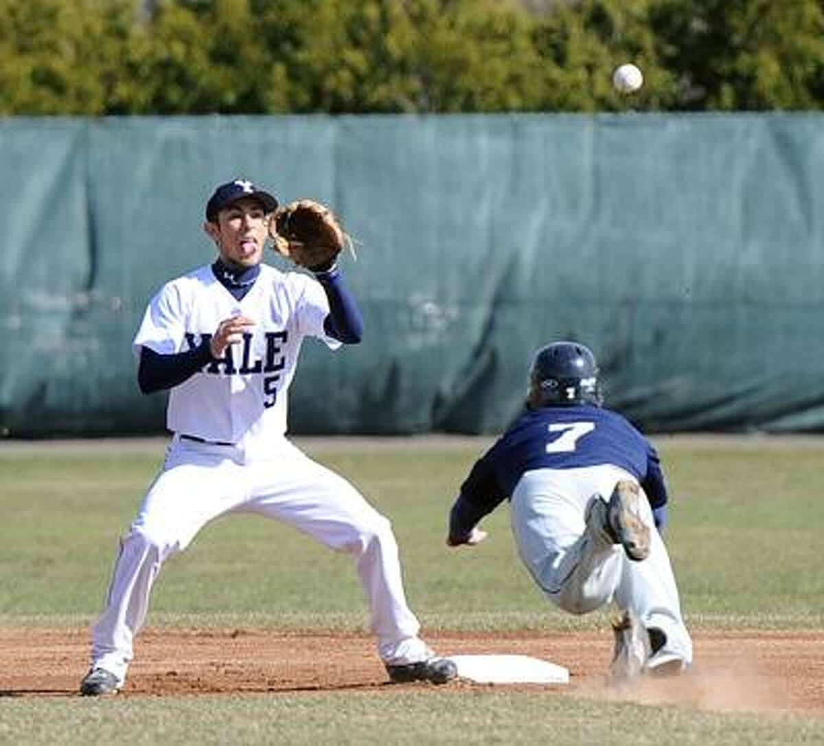 New Haven-- Quinnipiac's Mickey Amanti steals second base as Yale's Matt Schmidt waits for the throw. Photo by Peter Casolino/New Haven Register03/30/11 Cas110330
