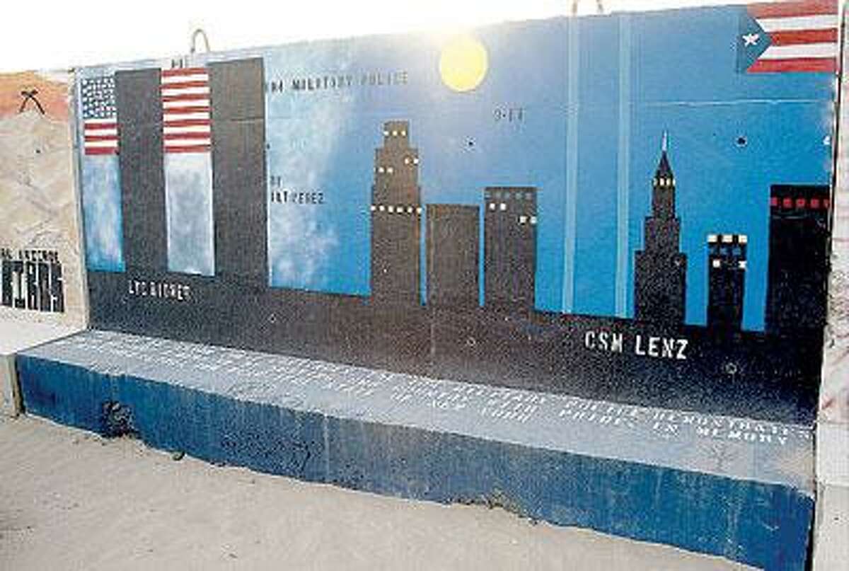 Photos from George Hauerâ€™s book â€œThe T-Walls of Kuwait and Iraq,â€ which documents the grafitti and artwork made by soldiers in the field. Different units each decorate the â€œT-walls,â€ which surround the base at Camp Buehring. For example, the 104 Military Police Unit panel, above, features the New York skyline and the World Trade Center. (Contributed)
