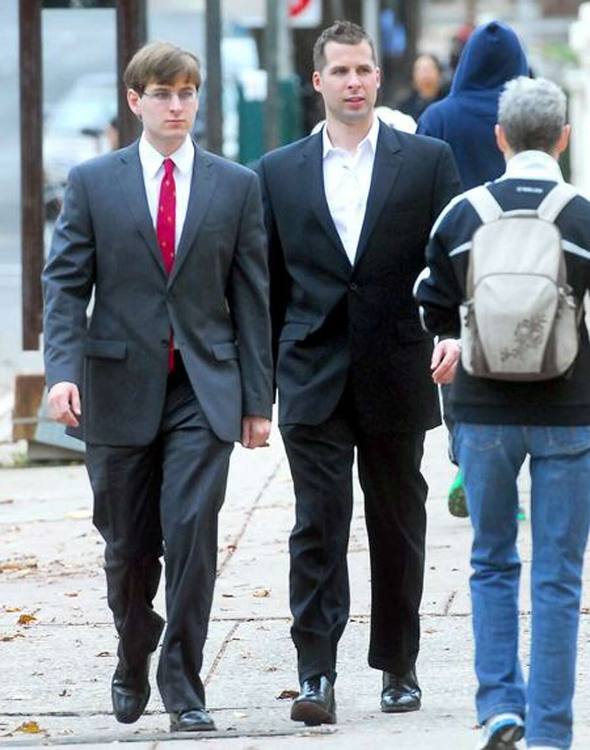 James Kos, left, and his brother, Matthew Kos, walk into Superior Court in New Haven Monday. (Arnold Gold/Register)