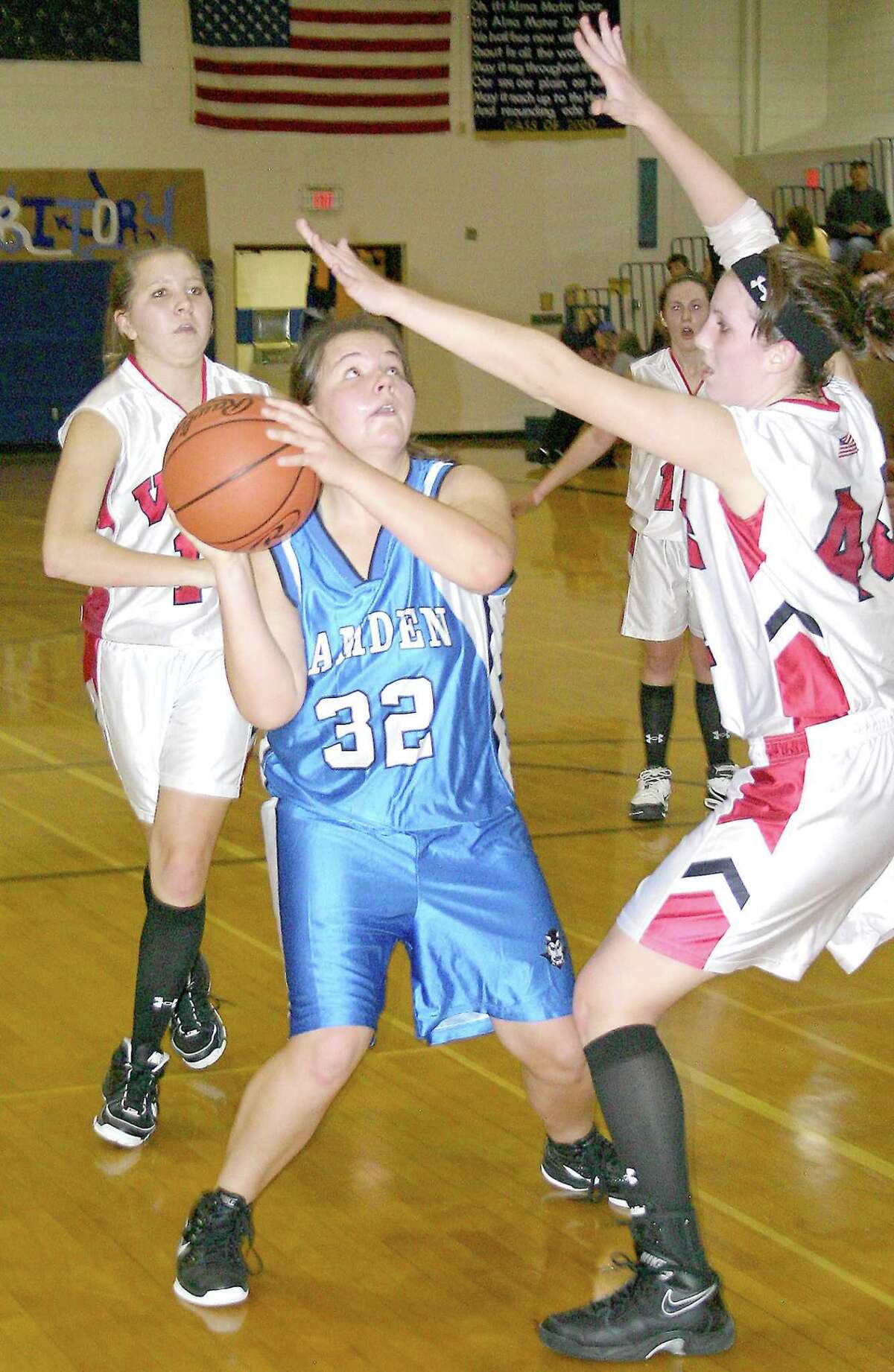 Submitted Photo by JON RATHBUN Camden's Michelle Wishart (32) looks to shoot over VVS' Leanne Doolen, right, in the opening game of the Dolgeville Tournament Saturday, November 26, 2011. Red Devils point guard Marissa Randall backs up the play. The Blue Devils won 53-48.