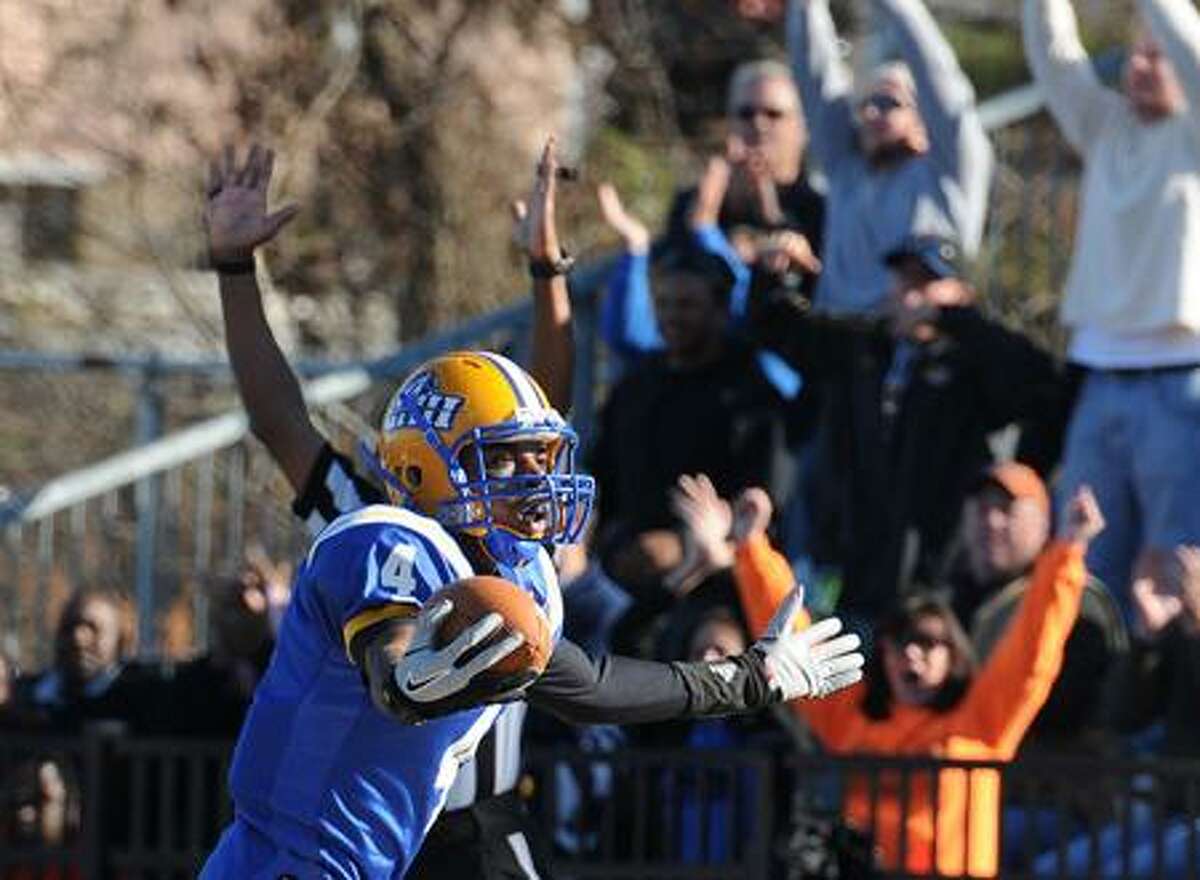 New Haven--UNH's Jason Thompson reacts after his first TD against Kutztown during the second quarter. Thompson had 3 TD's in the second quarter. Peter Casolino/New Haven Register11/26/11