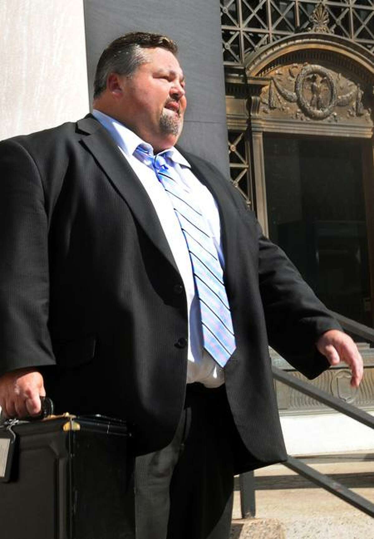 Christopher W. Caldwell, lawyer for Gregory Loles, leaves court Tuesday in New Haven. Melanie Stengel/Register