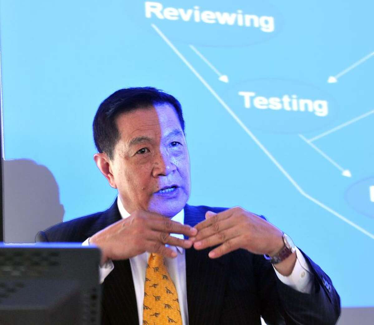 Henry C. Lee talks to police chiefs, detectives and forensics experts from around the state about new technologies available to them during a seminar at the Henry C. Lee Institute at the University of New Haven. Peter Casolino/Register