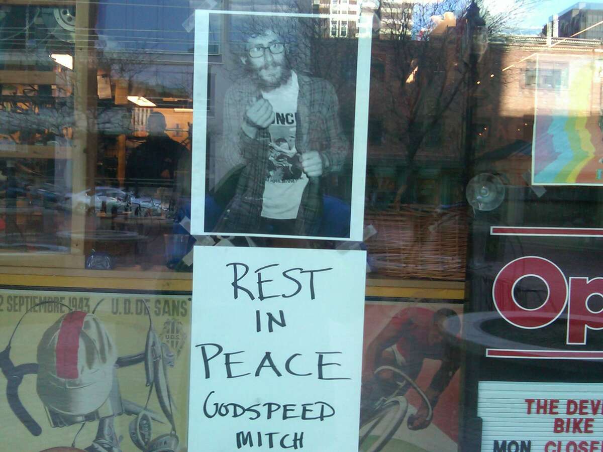 Mitchell Dubey, of 29 Bassett St., was fatally shot late Thursday. This sign is posted at The Devil's Gear Bike Shop in New Haven, where he worked. Photo by William Kaempffer