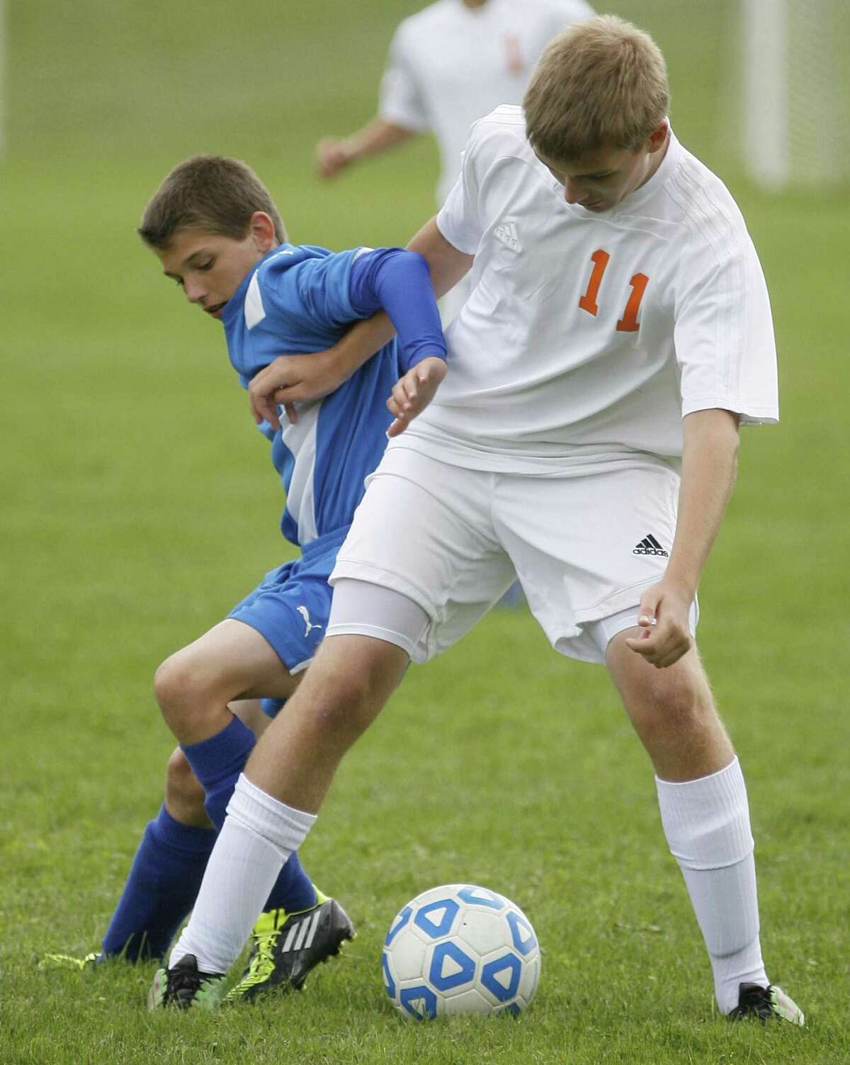Dispatch Staff Photo by JOHN HAEGER twitter.com/oneidaphoto Camden Bailey Dixon (11) and Oneida Kyle Friend (11) hold each other off as they work for the ball in the first half of the match in Oneida on Thursday, Sept. 15, 2011.