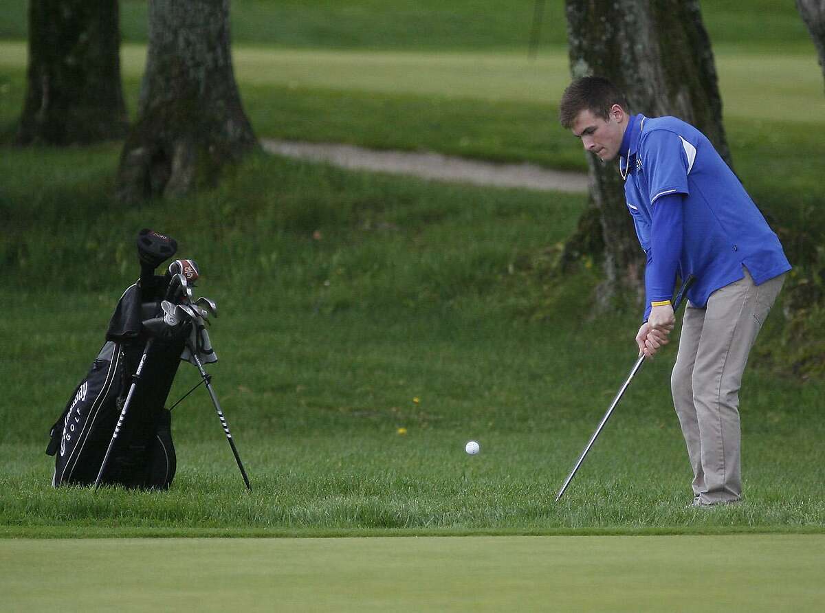 Dispatch Staff Photo by JOHN HAEGERCamden Jack Keil chips onto the green on the 5th during the TVL Championship in Clinton on Tuesday, May 18, 2011.