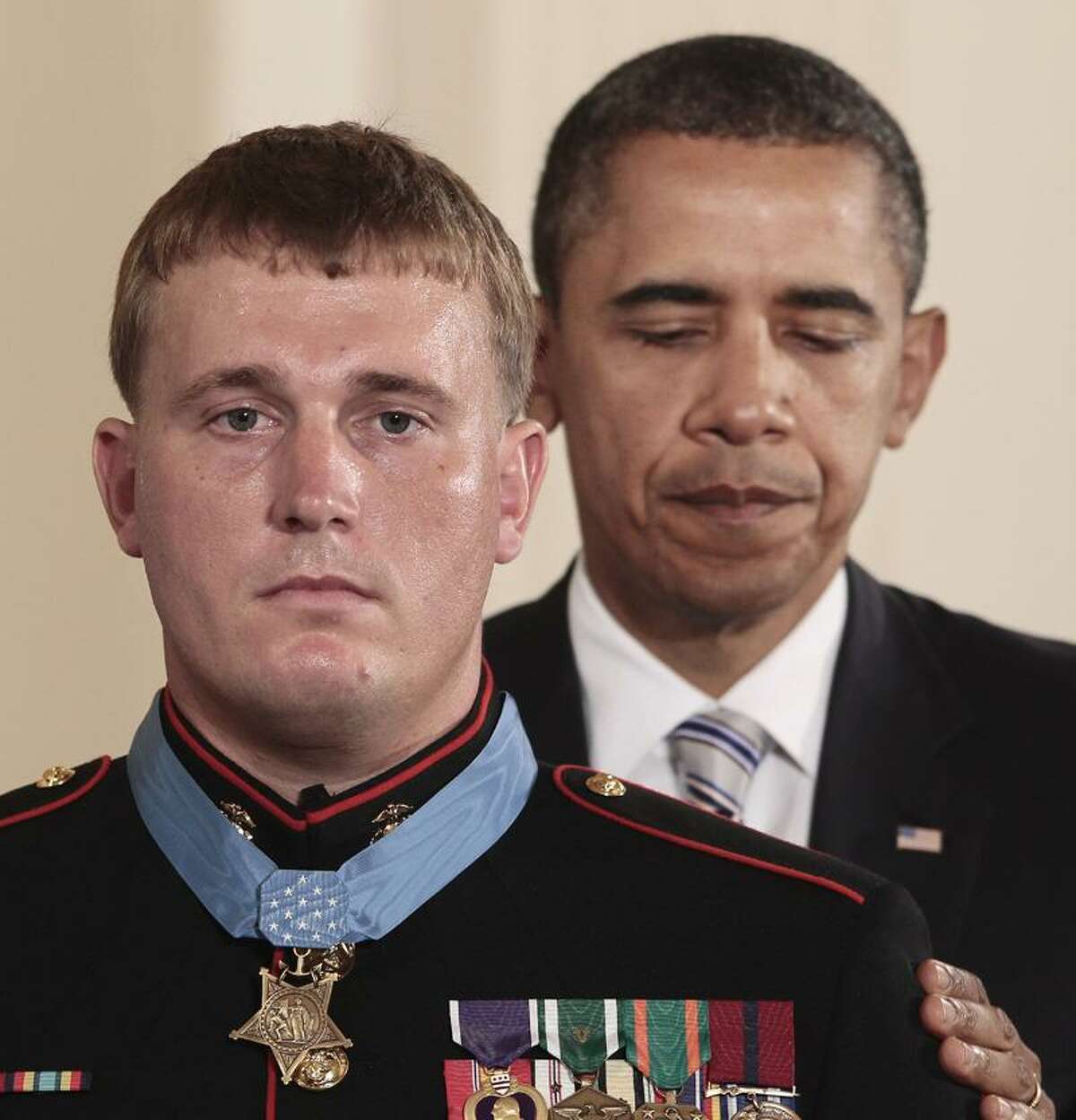 President Barack Obama awards the Medal of Honor to former Marine Cpl. Dakota Meyer, 23, from Greensburg, Ky., Thursday during a ceremony in the East Room of the White House in Washington, D.C. Meyer, now a sergeant, was in Afghanistan's Kunar province in Sept. 2009 when he repeatedly ran through enemy fire to recover the bodies of fellow American troops. He is the first living Marine to be awarded the Medal of Honor for actions in Iraq or Afghanistan. Associated Press