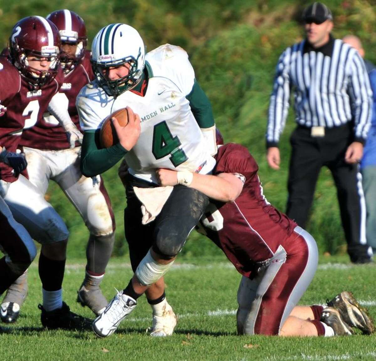 T.J. Linta of Hamden Hall gets tackled behind the line of scrimmage by Gordon Driscoll of Hopkins during the overtime period of football action Saturday 11/12/11 at Hopkins. Photo by Peter Hvizdak / New Haven Register November 12, 2011 ph2406 Connecticut