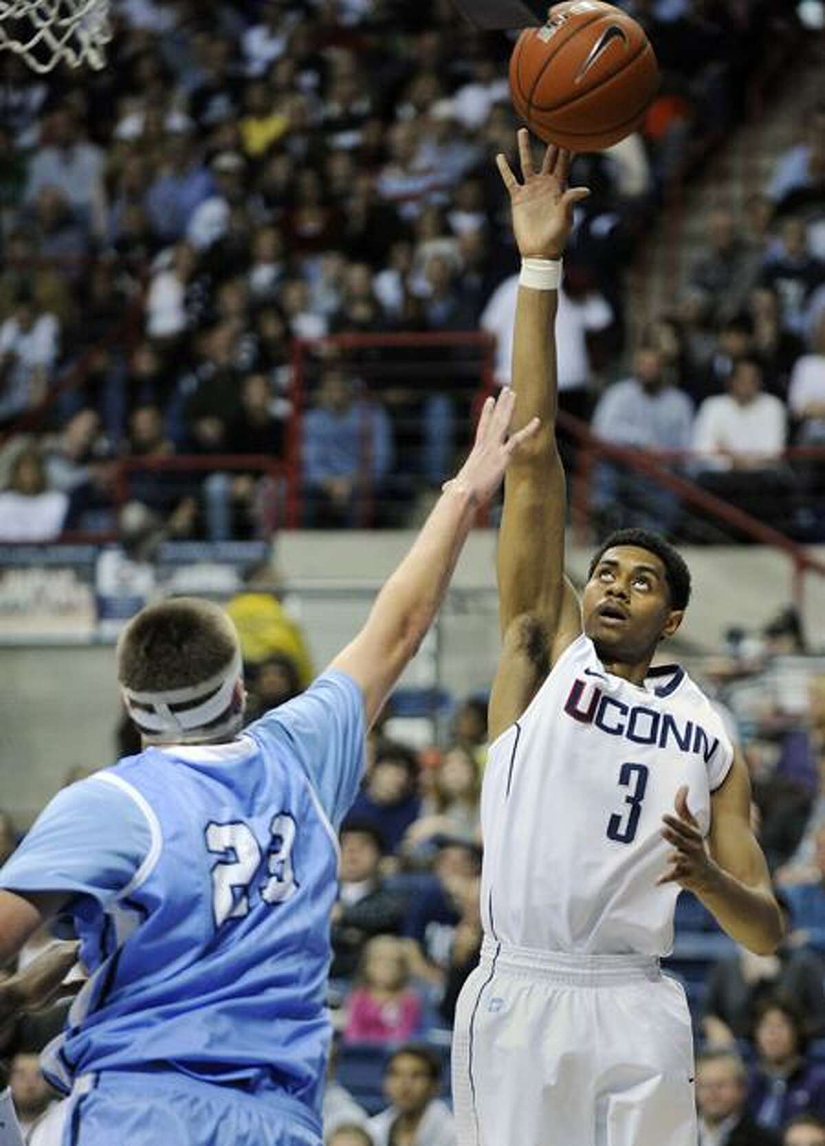 Connecticut's Jeremy Lamb, right, shoots over Columbia's Cory Osetkowski during the first half of their NCAA college basketball game, Friday, Nov. 11, 2011, in Storrs, Conn. (AP Photo/Fred Beckham)