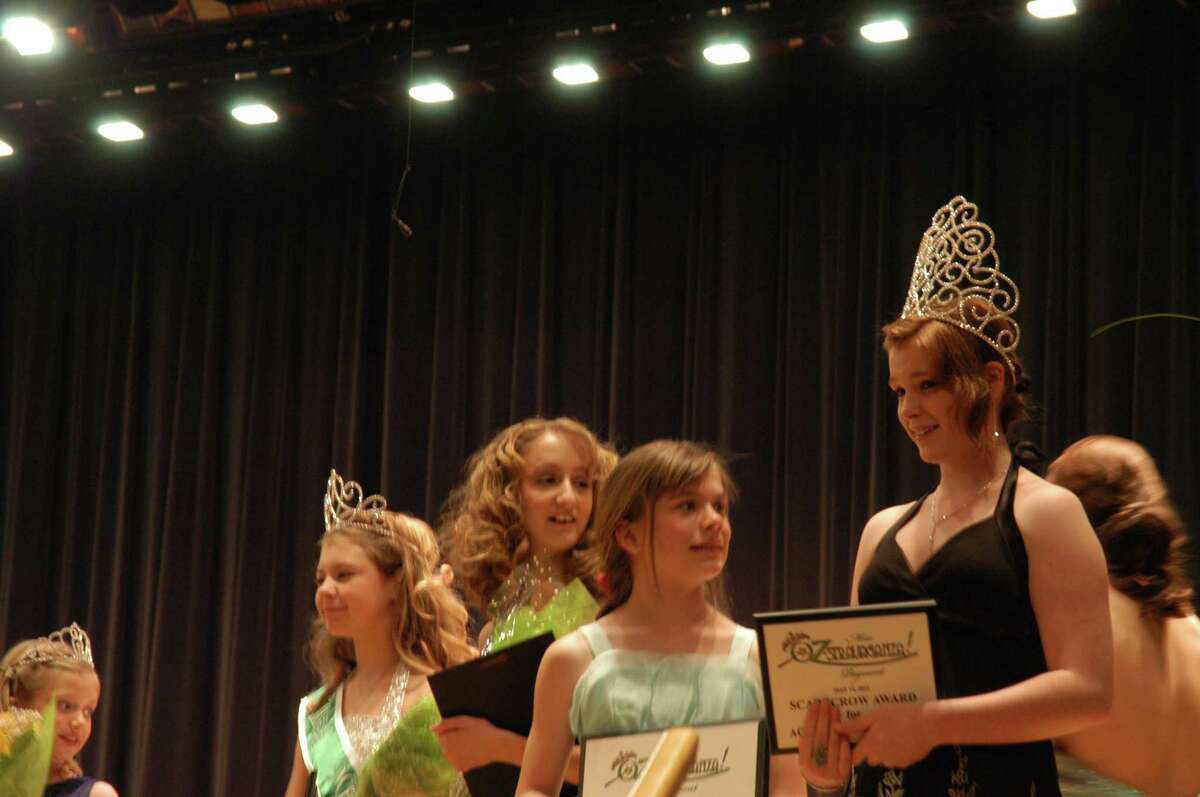Photo by Caitlin Traynor Chittenango High School Junior Lynea D'Aprix is crowned Miss Oz-Stravaganza Saturday. She will serve as an ambassador during Oz-Stravaganza weekend and ride with the parade's grand marshall.