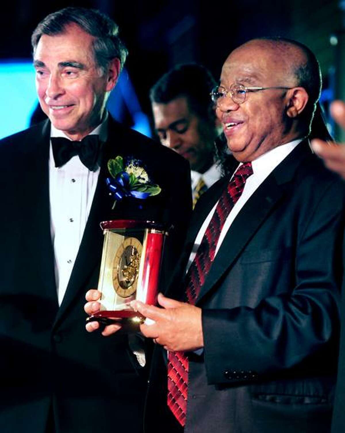 Bruce Alexander, left, vice president of Yale University, presents James P. Comer with the Lifetime Achievement Award at the NAACP Greater New Haven Branch Freedom Fund dinner Saturday at Yale Commons in New Haven. Arnold Gold/Register