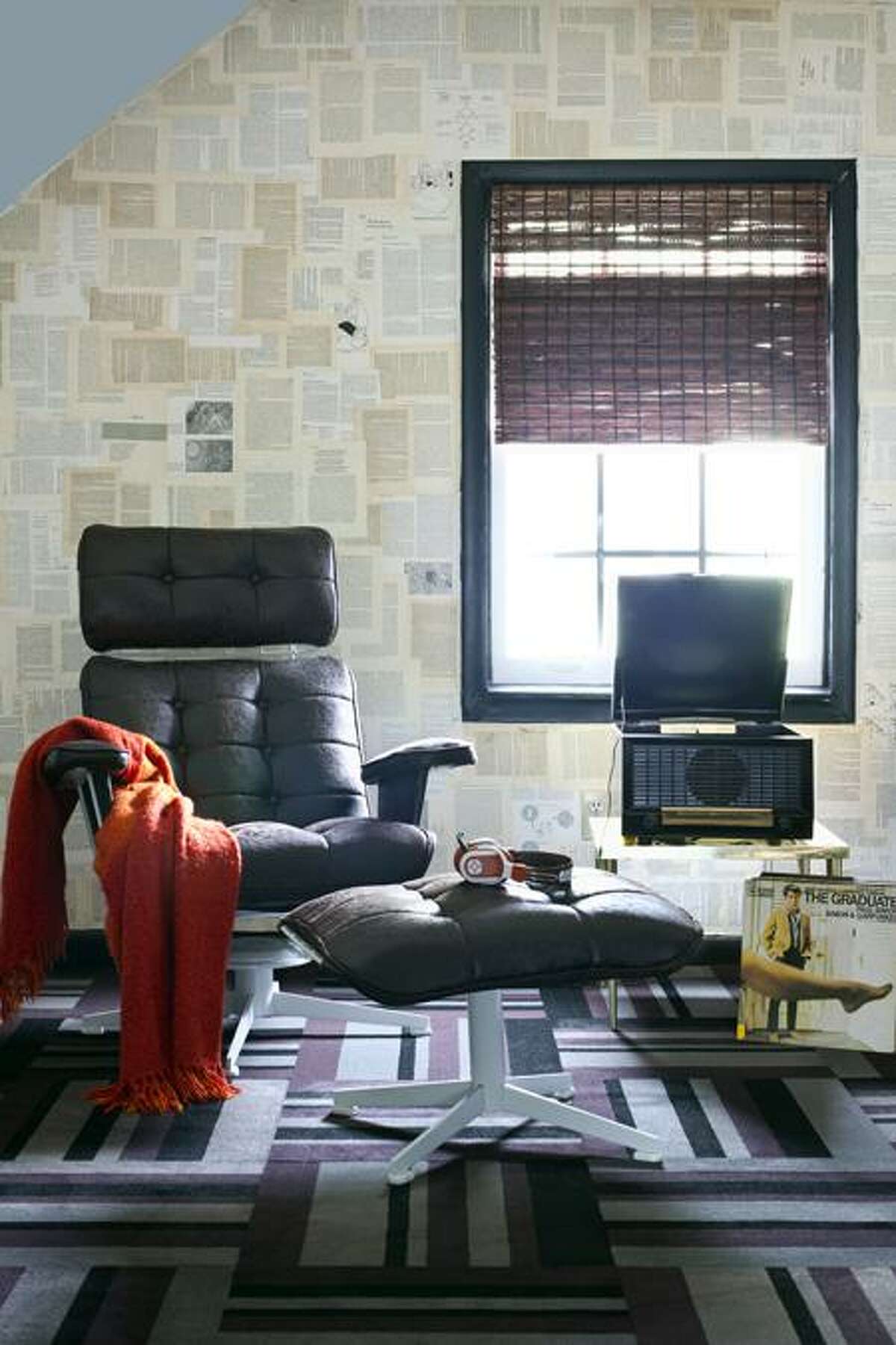 This undated photo courtesy of Christina Wedge shows a room designed bv Brian Patrick Flynn/Houzz.com. Even if you're not a student right now, you can create a space for reading or pursuing a hobby. Any quiet alcove or area will do, says Flynn, founder and editor of decordemon.com. Flynn covered the walls in this reading nook with pages from vintage books. (AP Photo/Christina Wedge)