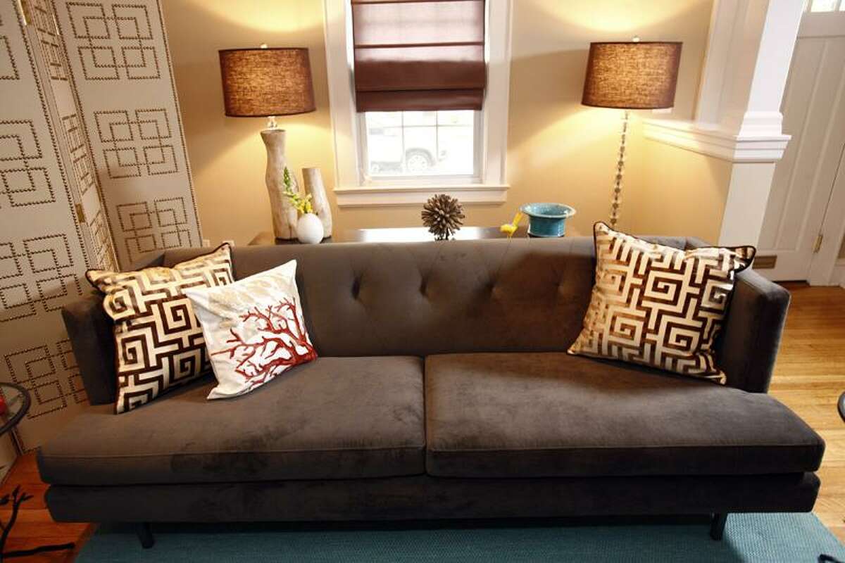 This undated photo courtesy of Scripps Networks, LLC shows a room designed by Sabrina Soto for HGTV's The High Low Project. Spring may be the season of cleaning out clutter and brightening up our homes, but fall can be equally inspiring. Soto is a fan of lampshades in warm fall colors like gold or scarlet. (AP Photo/Scripps Networks, LLC )